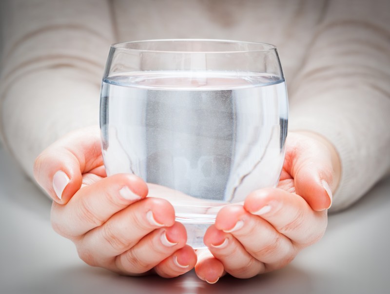 glass of water in hands