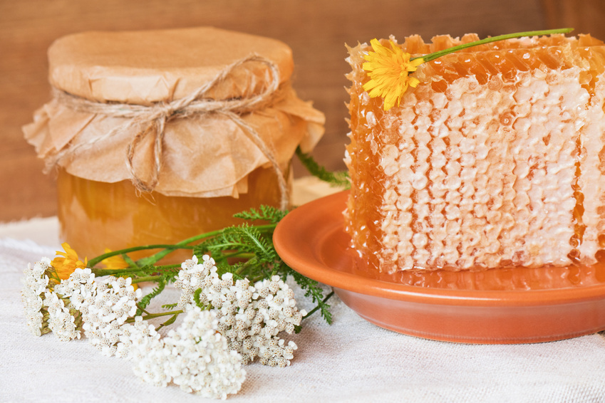 Flower honey in honeycombs and in a jar.