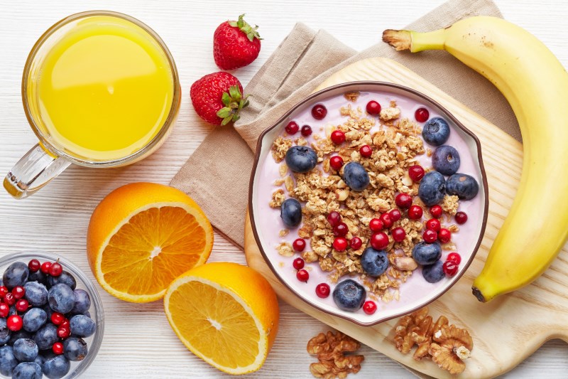 Healthy breakfast. Bowl of yogurt with granola and berries