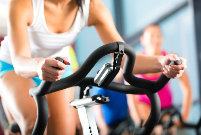 woman-exercising-on-bike